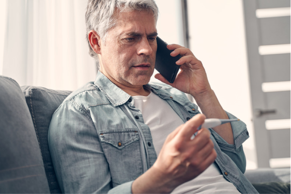 man-sick-fit-note-access-phone