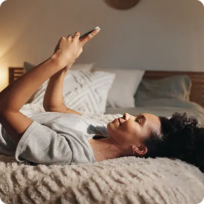 woman-on-bed-on-phone